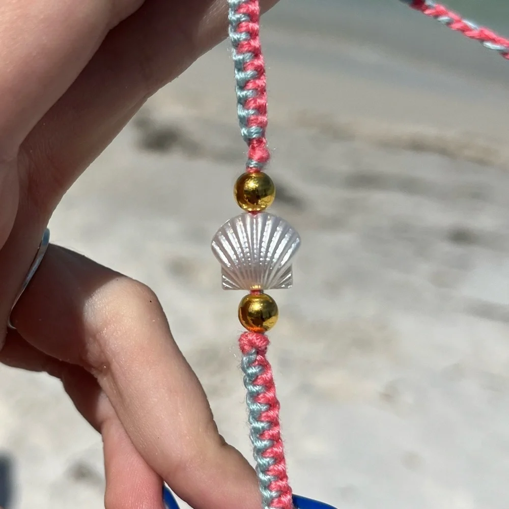 Handmade woven pink and blue zipper bracelet with pearl shell bead